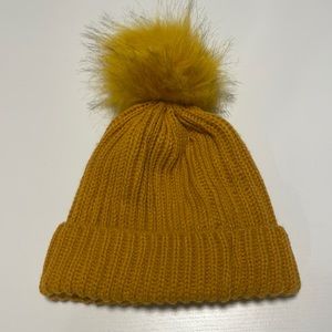 Mustard beanie with tags on inside still attached